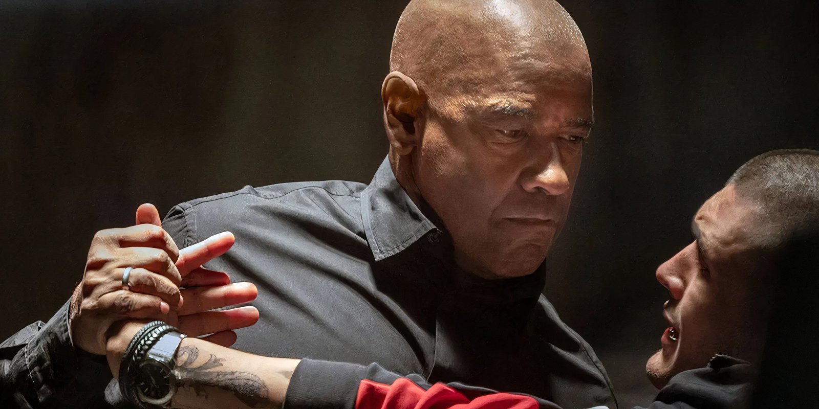 Denzel Washington grabbing an assailant in The Equalizer 3